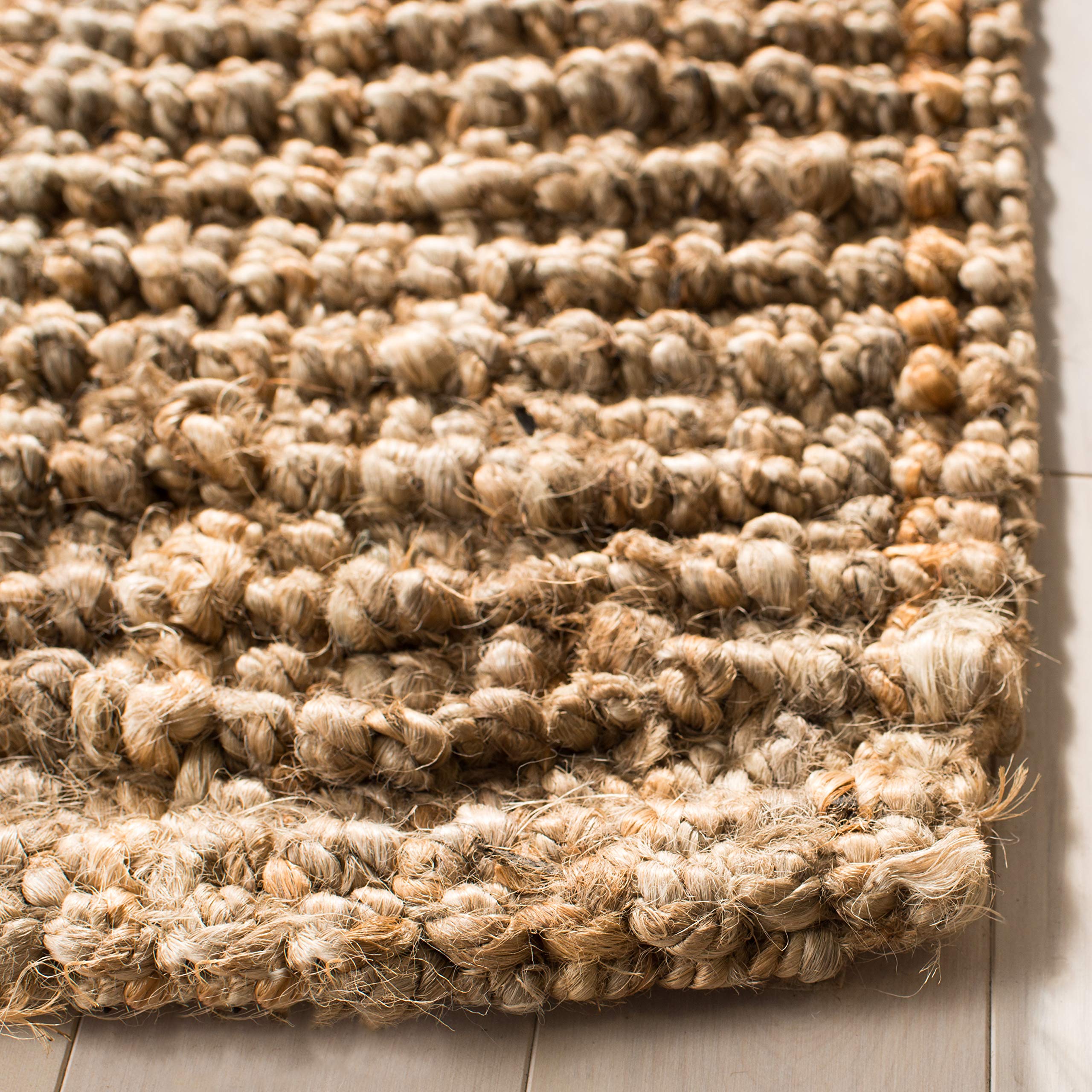SAFAVIEH rug in an entryway demonstrating warm, natural visual anchor