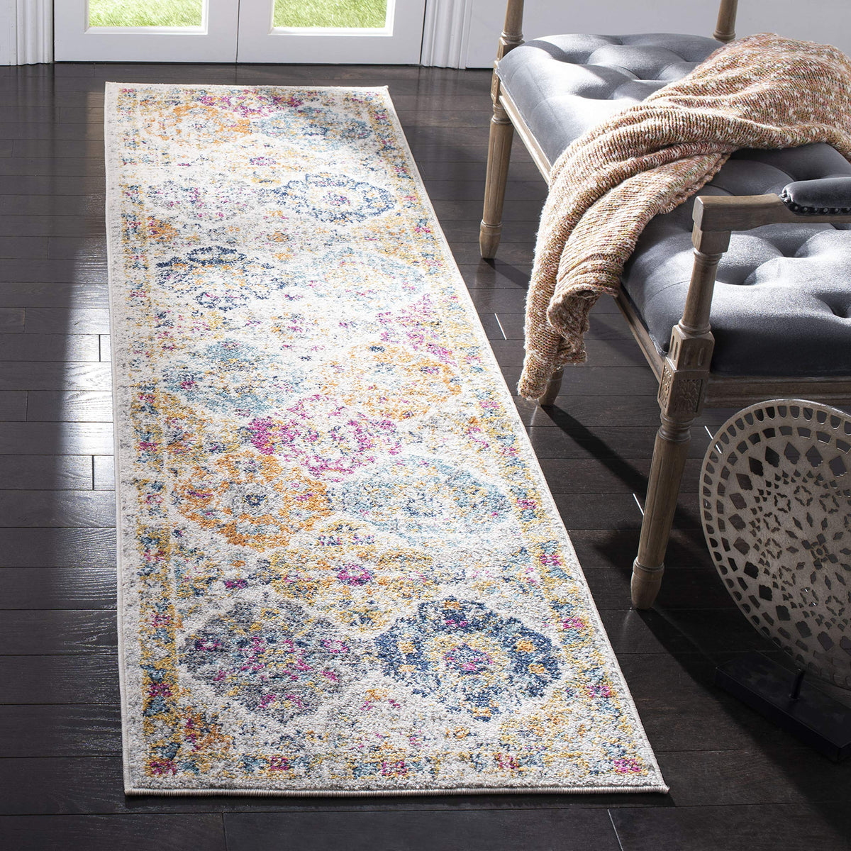 SAFAVIEH runner front view showing cream and multi medallions, enhances hallway style
