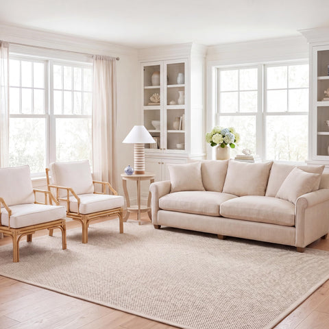 SAFAVIEH rug beside sofa showing scale and how it fits furniture layout