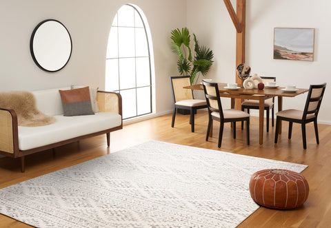 SAFAVIEH scale comparison with sofa and coffee table showing 8x10 coverage and proportional fit