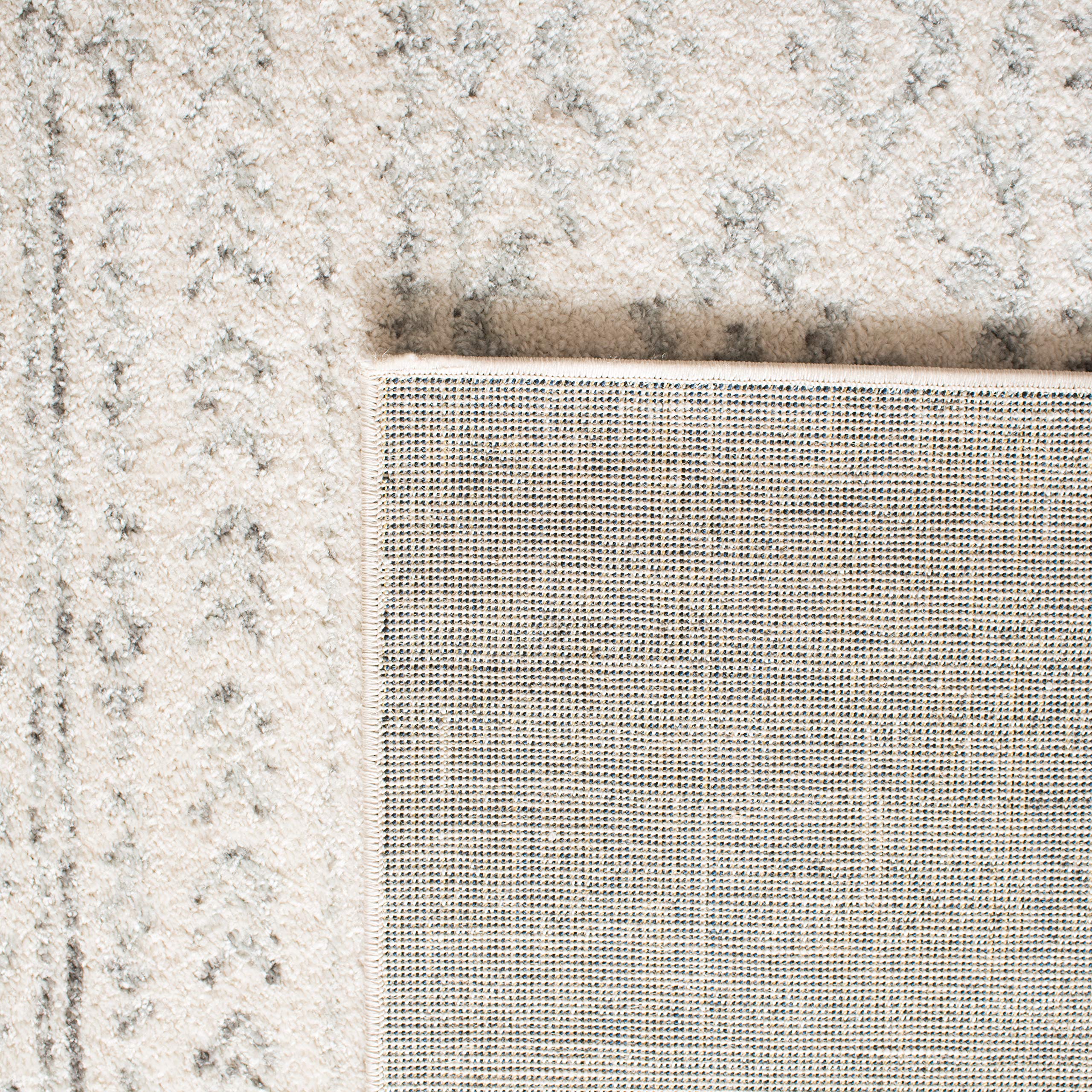 SAFAVIEH Tulum positioned under dining table showing easy-care surface and traffic resilience
