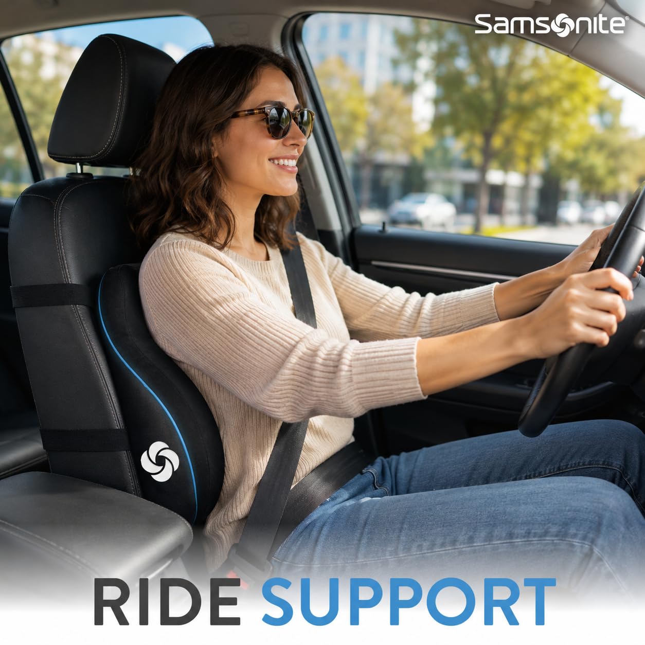 Samsonite lumbar pillow attached to car seat with strap for stable driving