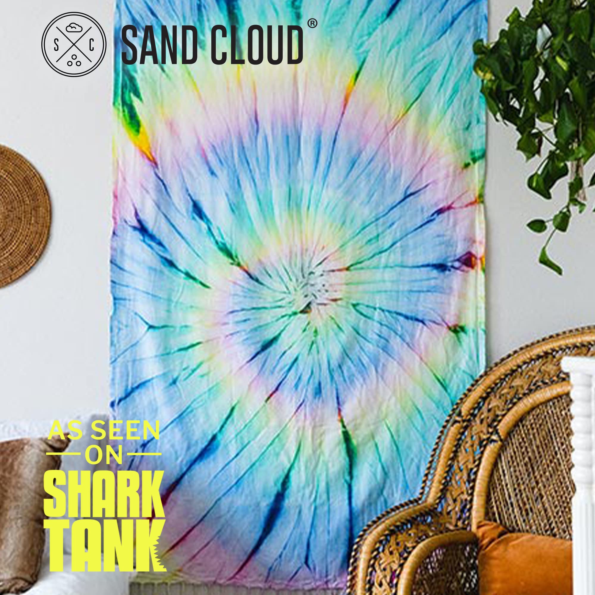 Sand Cloud towel rolled and packed in a backpack demonstrating lightweight portability