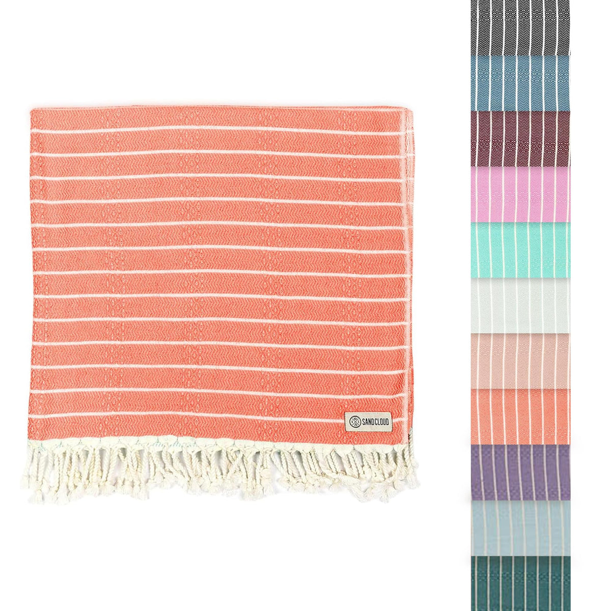 Sand Cloud front view showing Gocek Coral towel and compact size benefit