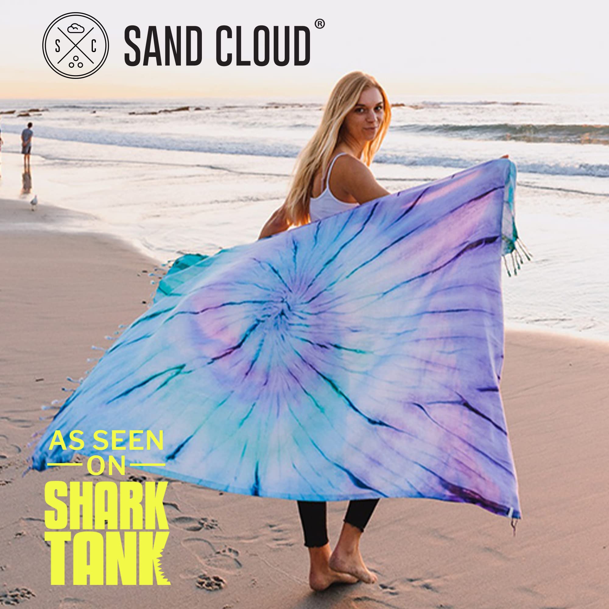 Sand Cloud Luna on beach in use showing quick-dry, sand-resistant benefit