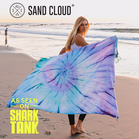 Sand Cloud Luna on beach in use showing quick-dry, sand-resistant benefit