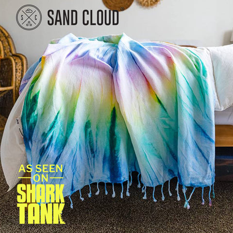 Sand Cloud draped over a yoga mat demonstrating multipurpose use and grip during practice