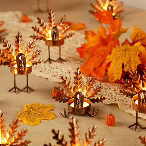 SAND MINE turkey holder lit on a Thanksgiving table adding warm candlelight ambiance