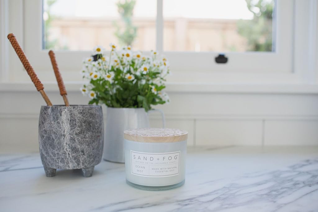 Sand + Fog candle next to common objects to show the 12oz scale benefit