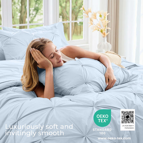 Sasttie comforter laid on made bed demonstrating full coverage and drape