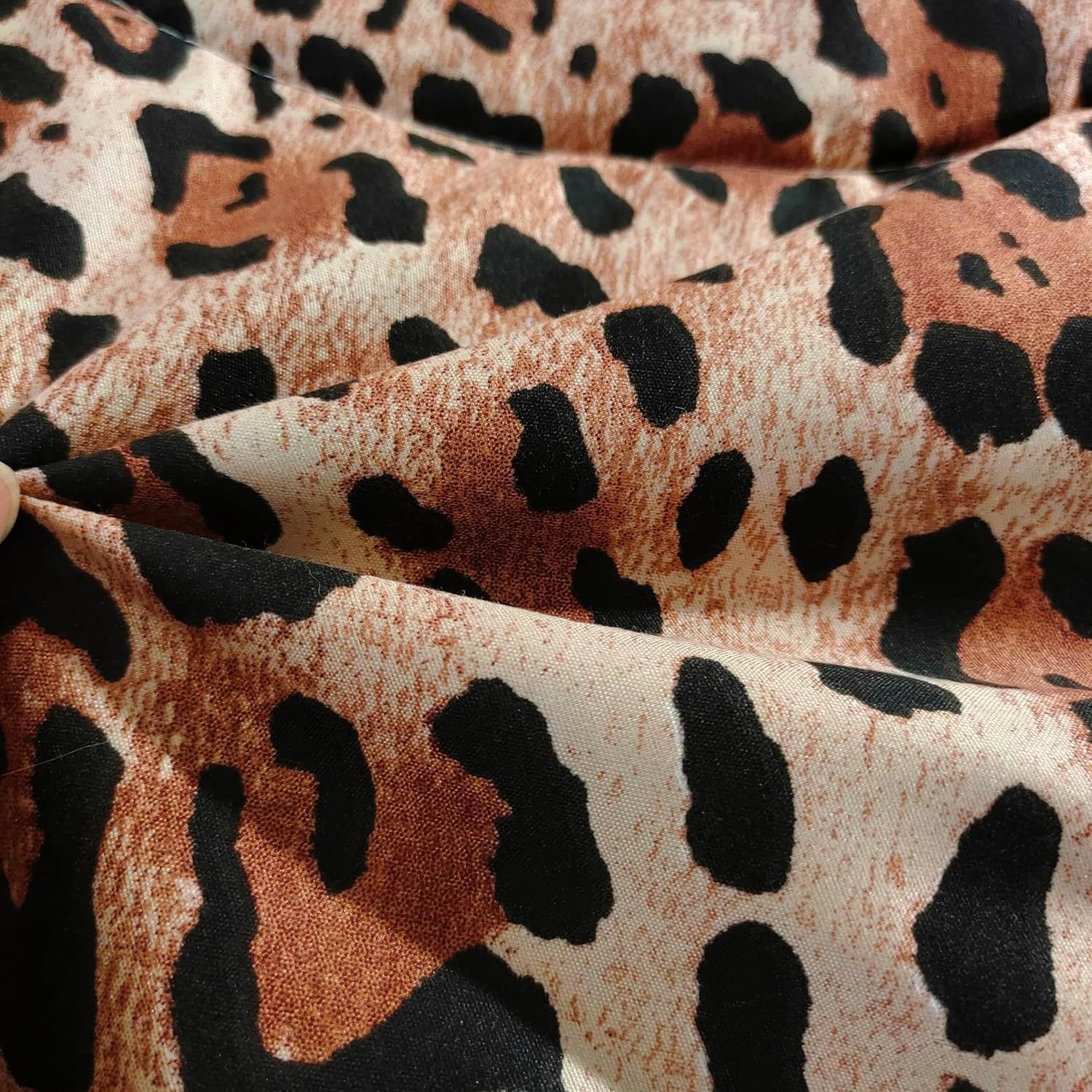 SDY comforter styled on bed in a decorated room to showcase lively cheetah design and atmosphere