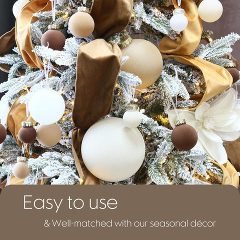 Sea Team ornaments hung on a living room tree creating cohesive neutral holiday styling