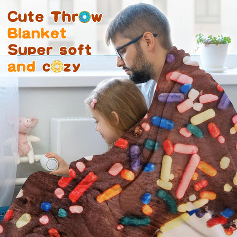 SeaRoomy chocolate donut blanket draped on couch in use for cozy movie night