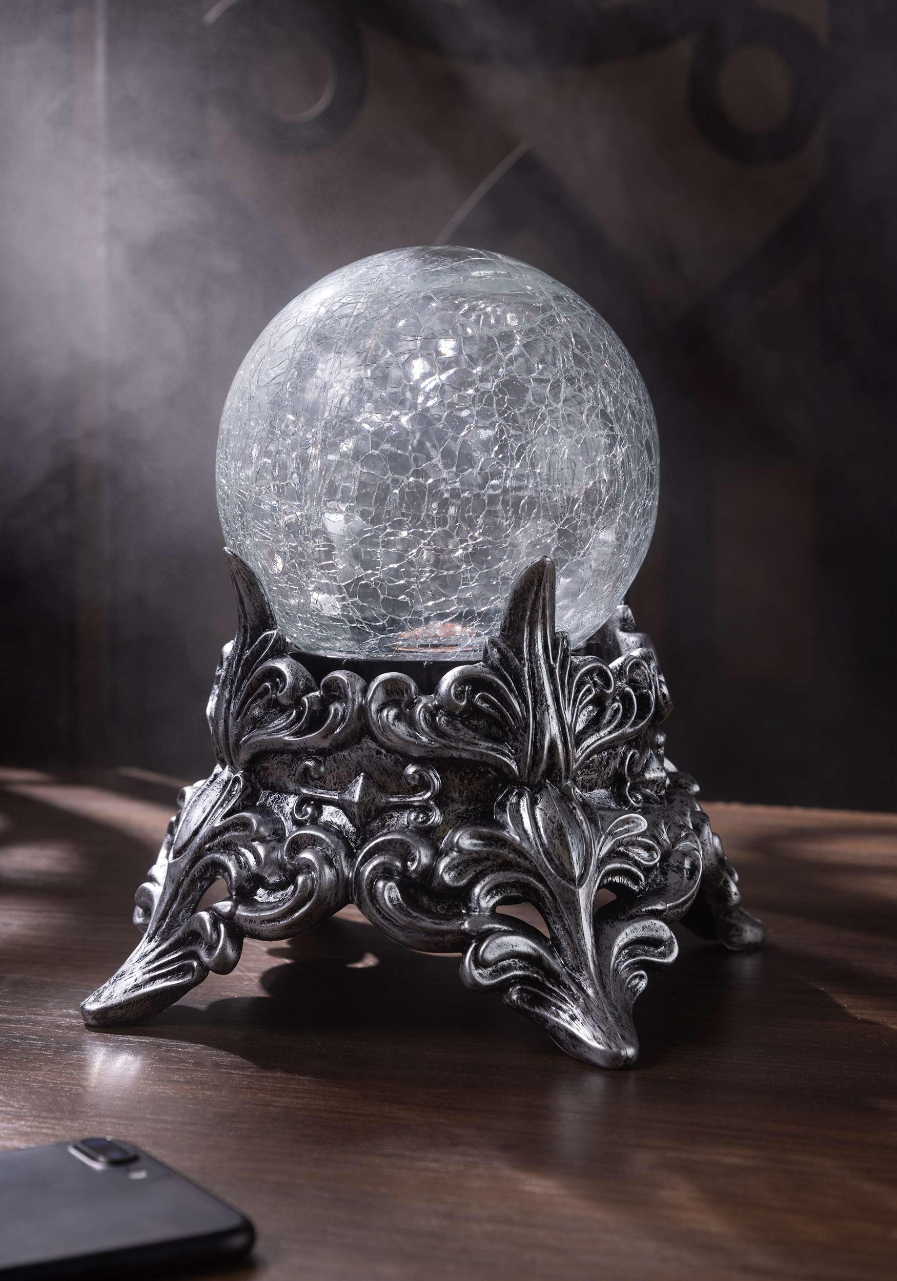 Seasons mystic crystal ball held in hand to show 7.5-inch scale and portable benefit