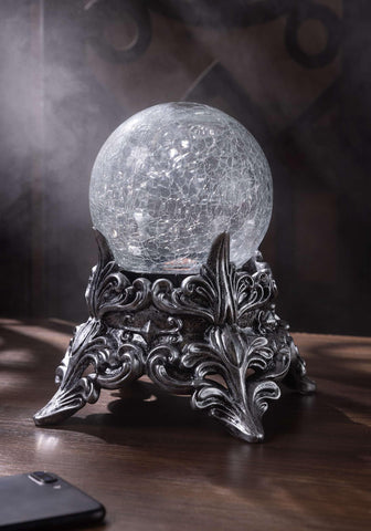 Seasons mystic crystal ball held in hand to show 7.5-inch scale and portable benefit