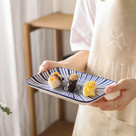 Selamica plate next to fork and knife showing size and scale for tabletop planning benefit