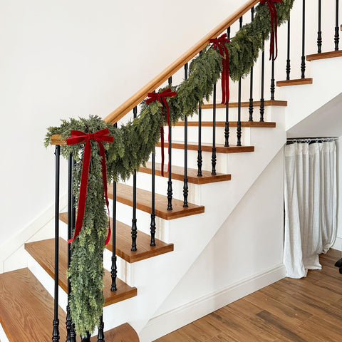 Senjie cedar garland wrapped on stair rail providing easy holiday styling