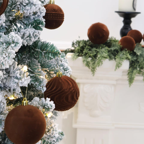 Senjie ornaments on a living room Christmas tree showing cozy, upscale holiday decor
