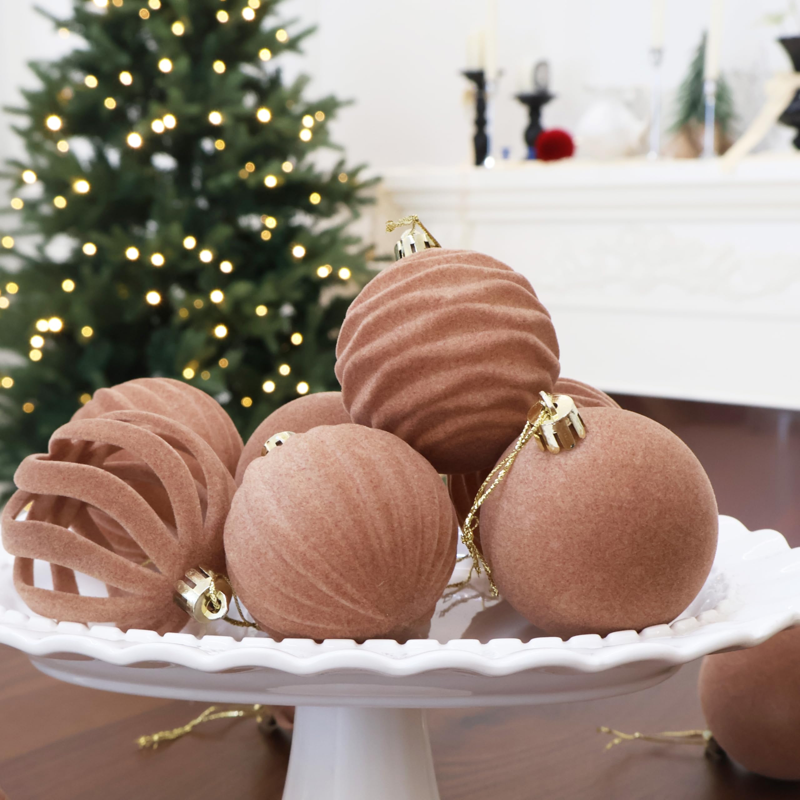 Senjie ornaments on a living room tree adding cozy, upscale seasonal style