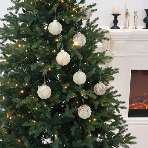 Senjie ornaments hanging on a decorated tree providing refined shimmer and layered contrast benefit