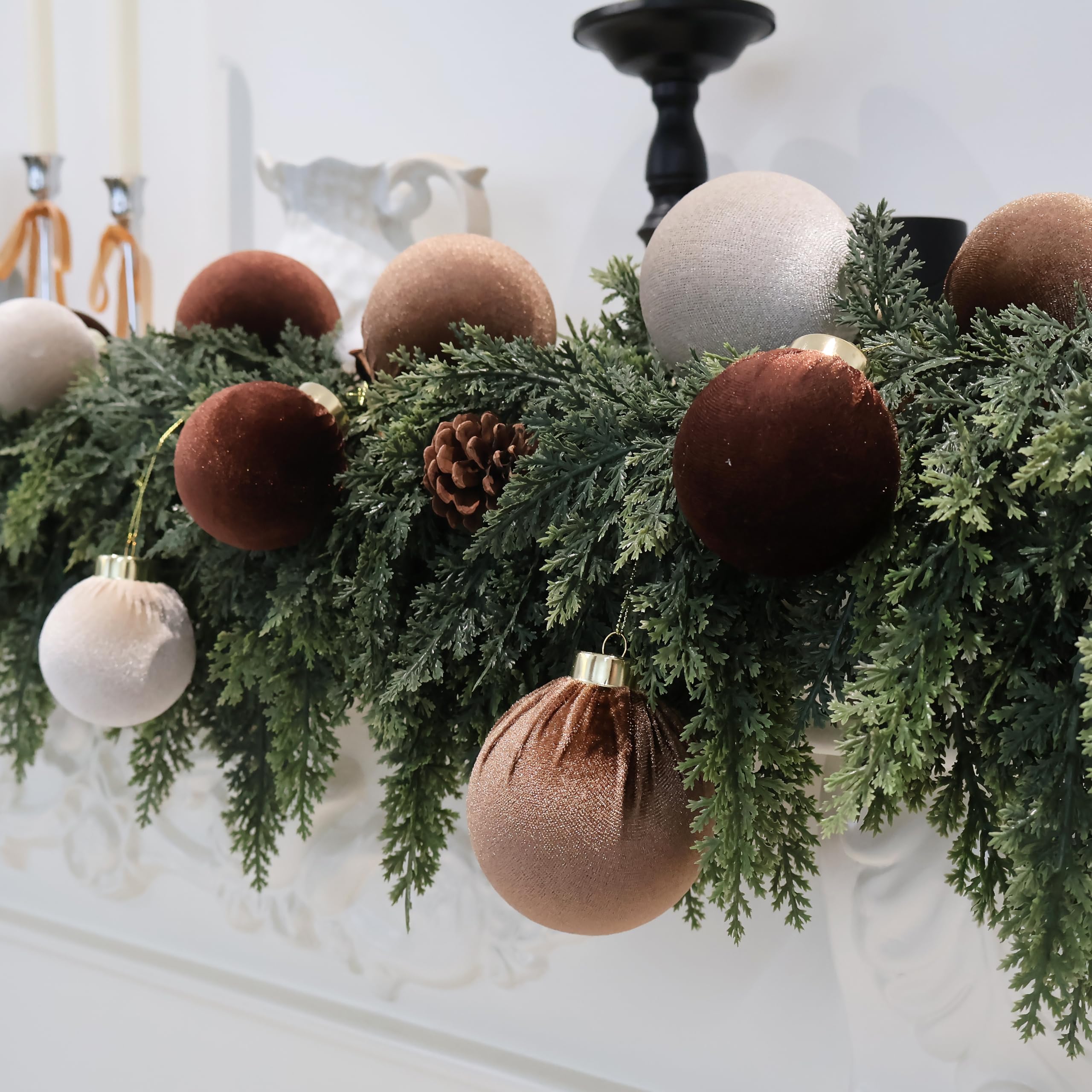 Senjie ornaments beside hand showing size and lightweight advantage