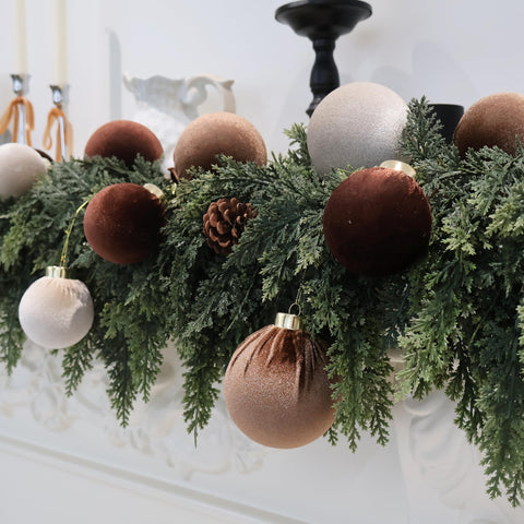 Senjie ornaments beside hand showing size and lightweight advantage