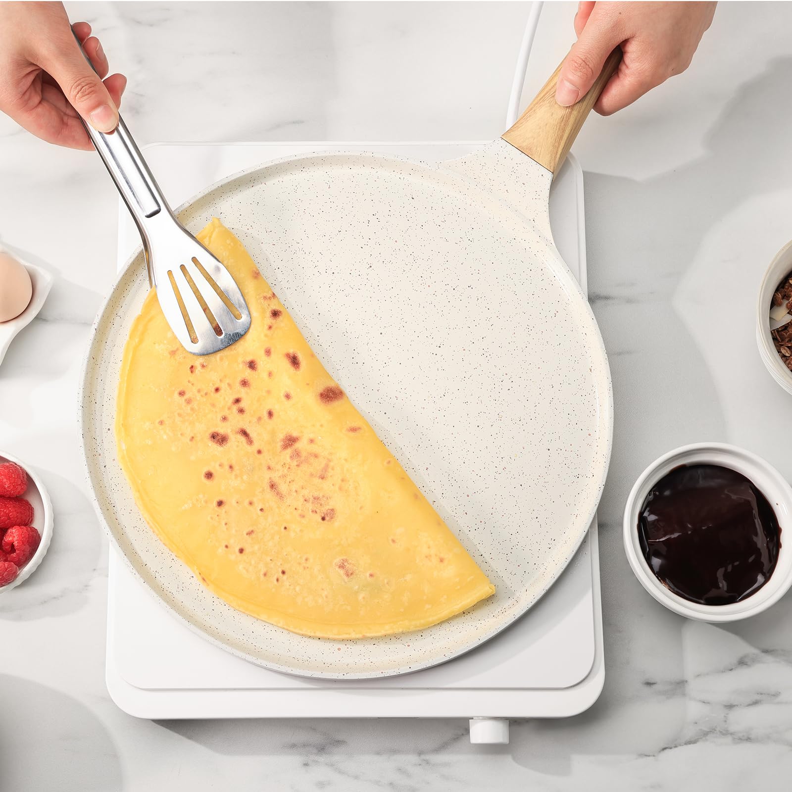 SENSARTE on a breakfast table with crepes and toppings, showcasing effortless home-cooking benefit