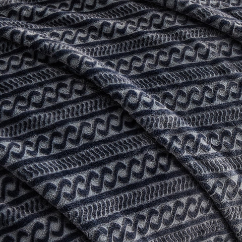 Serenhom family on couch with blanket illustrating comfort and multiuse versatility