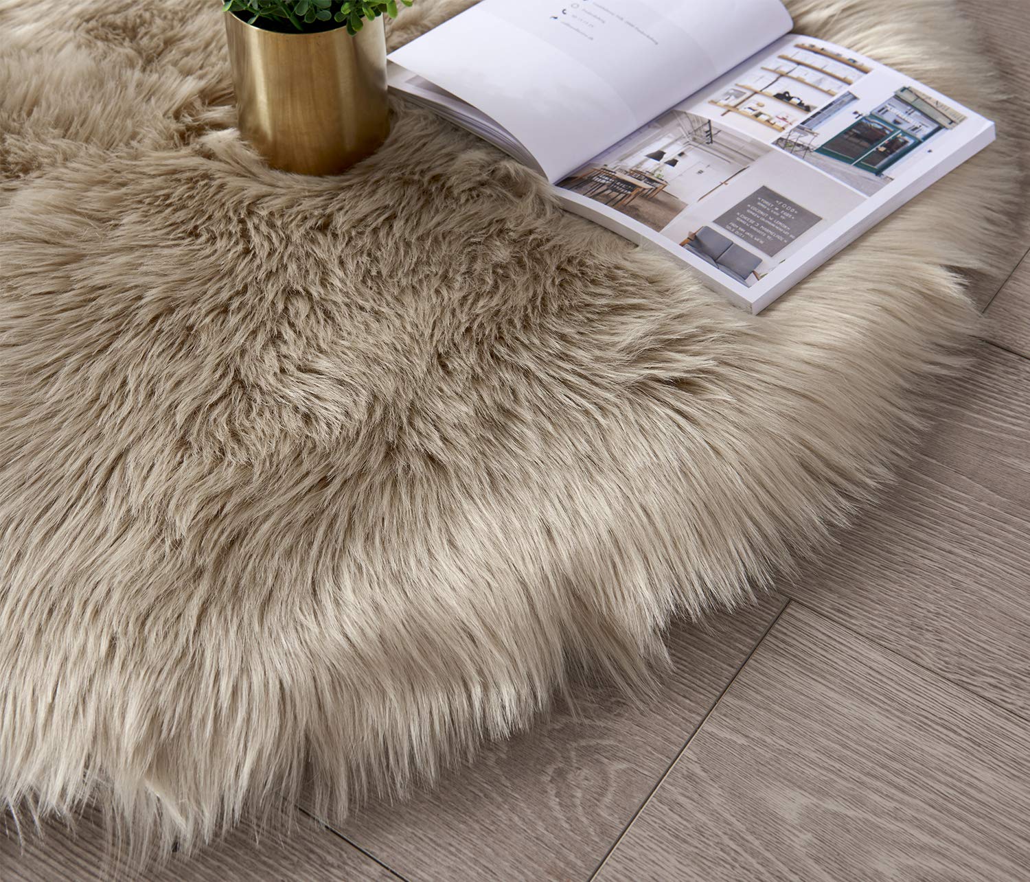 SERISSA rug beside sofa demonstrates scale and layered decor benefit