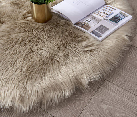 SERISSA rug beside sofa demonstrates scale and layered decor benefit