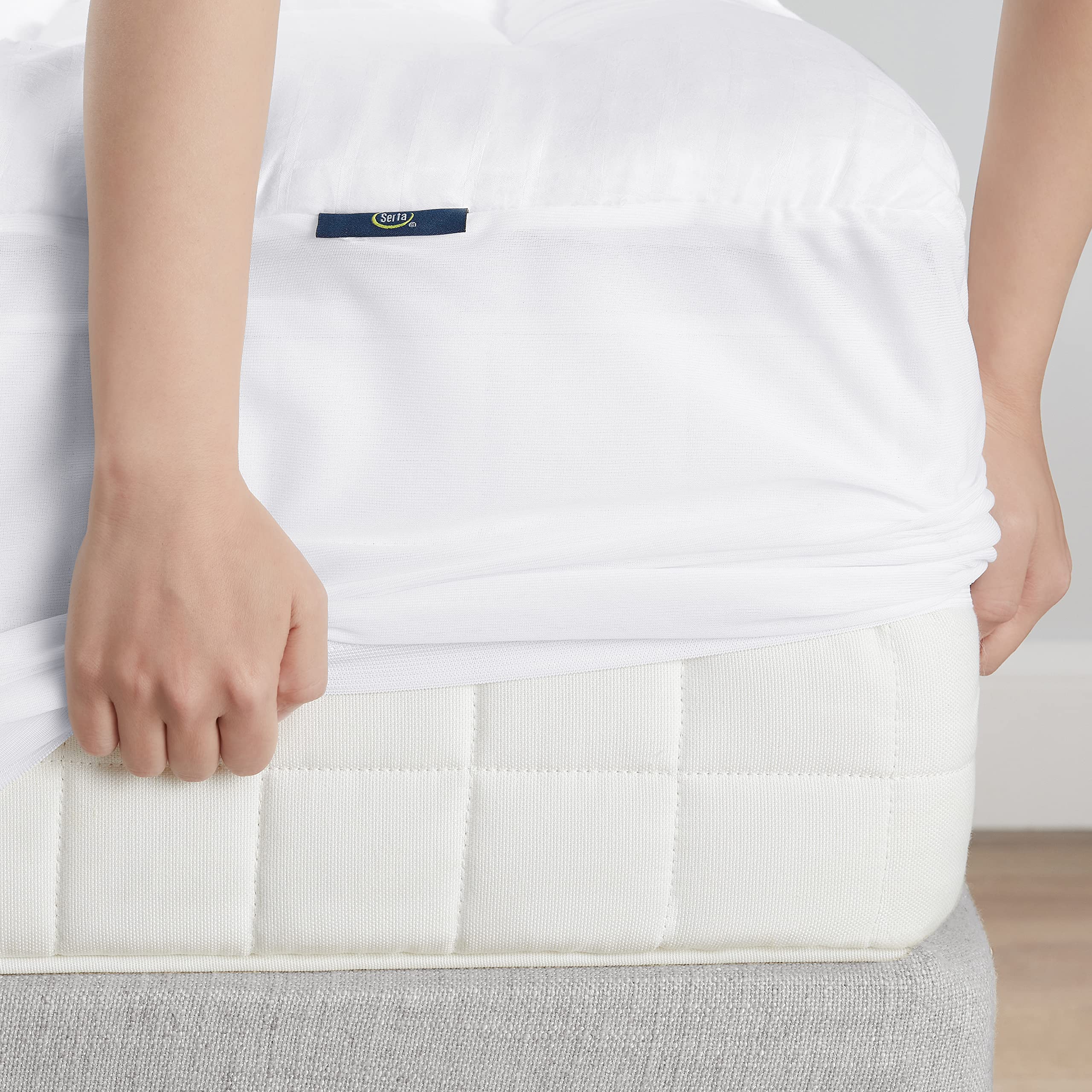 Serta pad side profile on mattress showing low profile cushion benefit