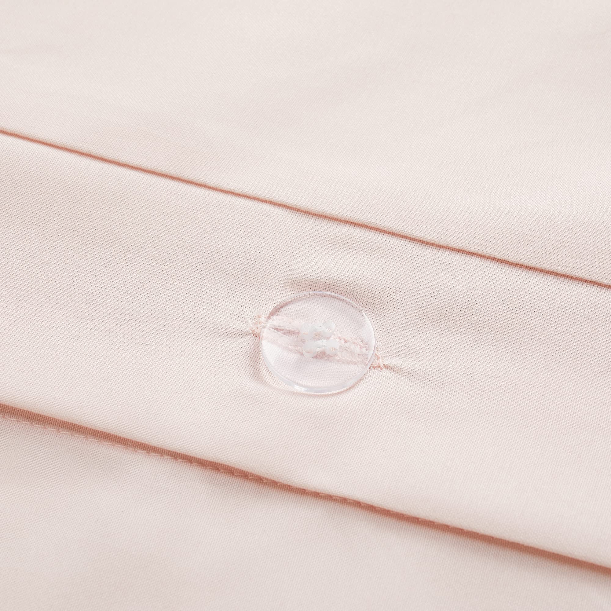 Serta duvet cover styled on made bed demonstrating tidy, modern bedroom