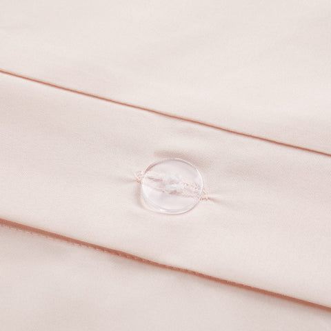 Serta duvet cover styled on made bed demonstrating tidy, modern bedroom