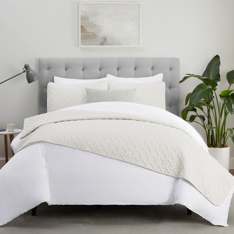 Serta quilt styled on bed in bedroom scene for cozy, inviting atmosphere