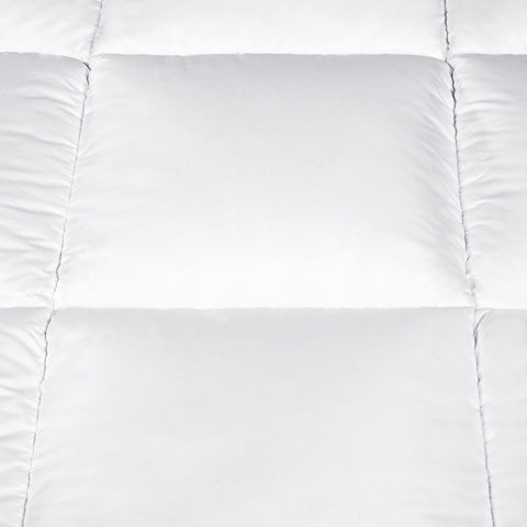 Serta comforter on mattress showing full/queen size coverage and fit
