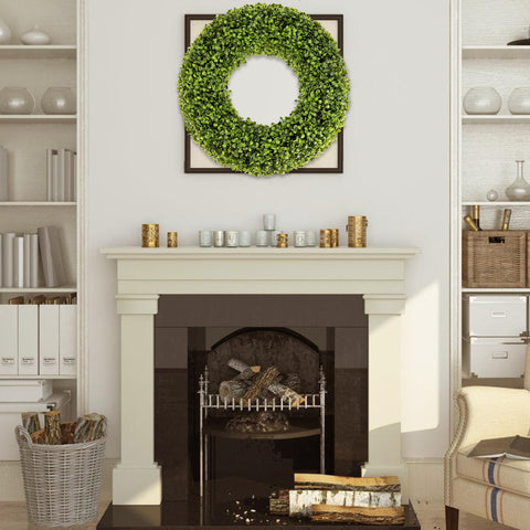 SEVENLOVE wreath on a porch adding year-round green décor and warmth