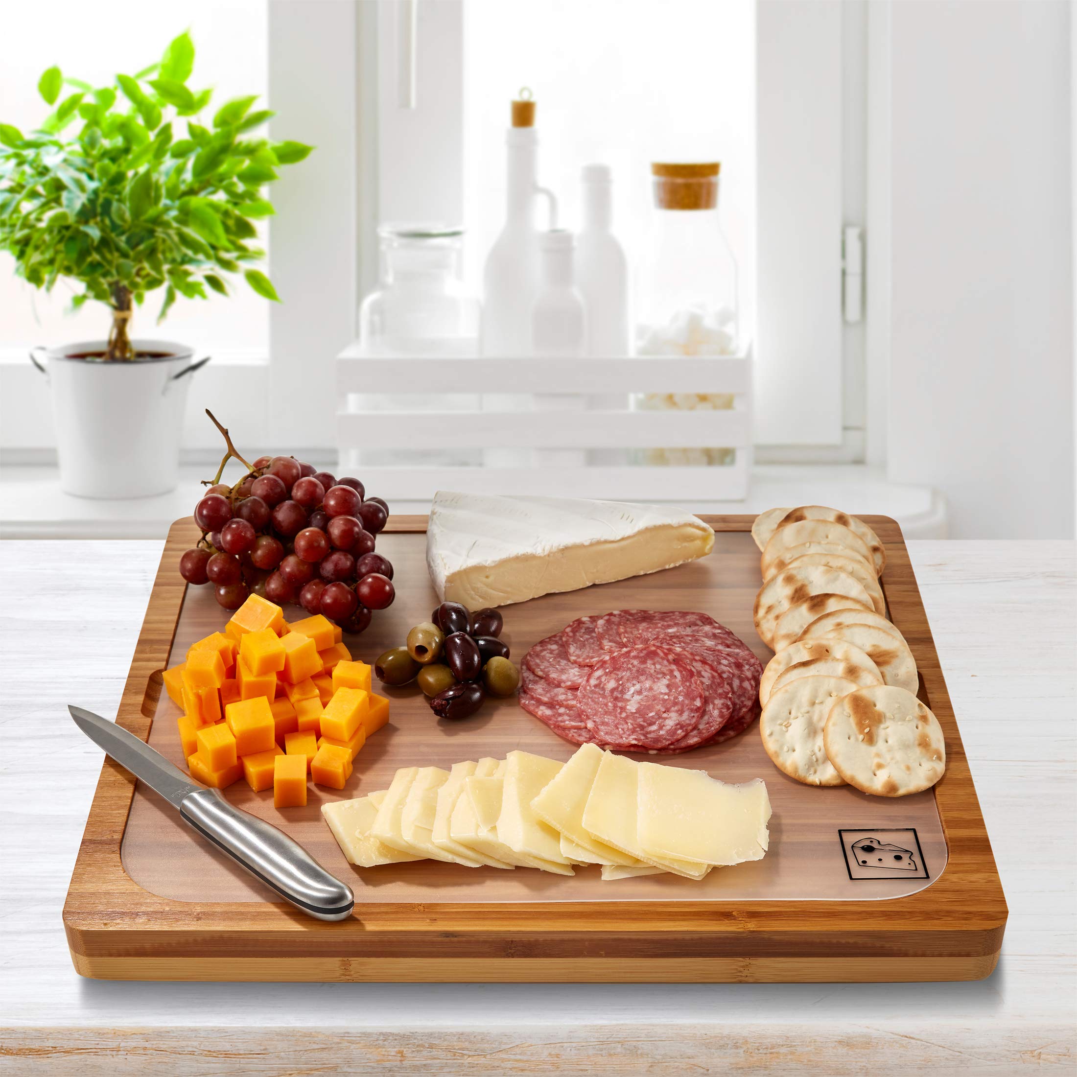 Seville Classics serving charcuterie on bamboo board for attractive presentation