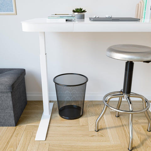 Seville Classics wastebasket next to a desk showing scale and fit for home office