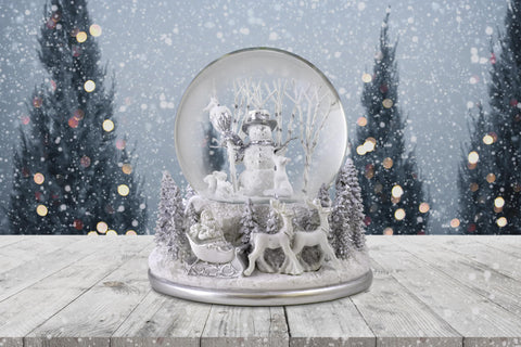 The San Francisco Music Box Company white base sculpture showing Santa and reindeer for storytelling appeal