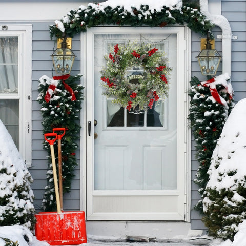 Sggvecsy wreath above mantel creating festive living room focal point