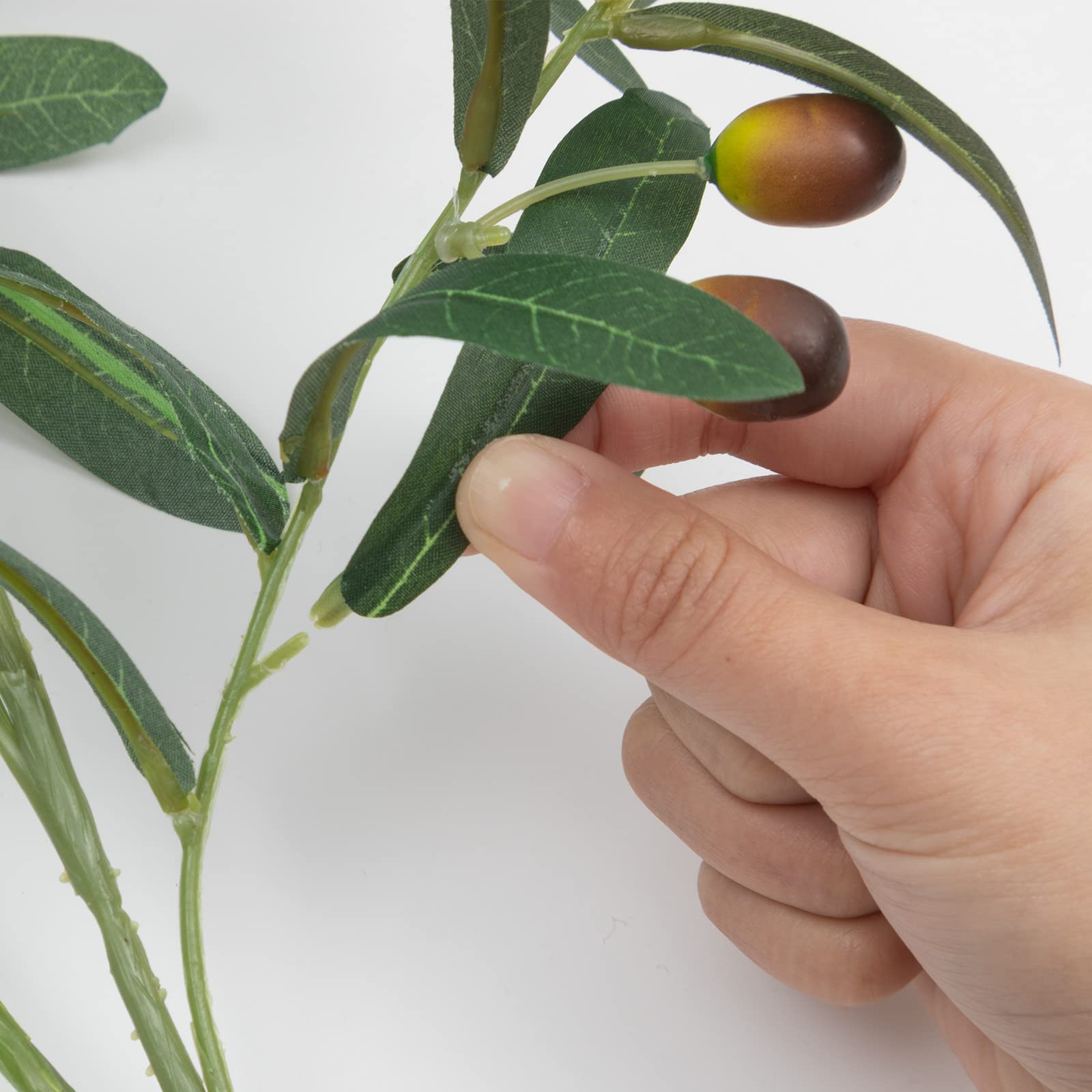 SHACOS hands bending a stem to shape arrangement and secure placement