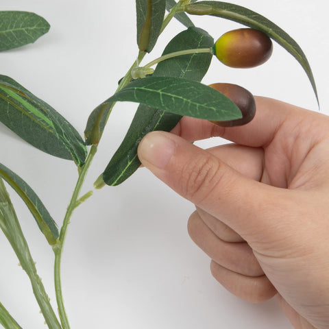 SHACOS hands bending a stem to shape arrangement and secure placement
