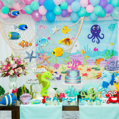 Shappy fish net hung as photo booth backdrop creating seaside atmosphere for guests