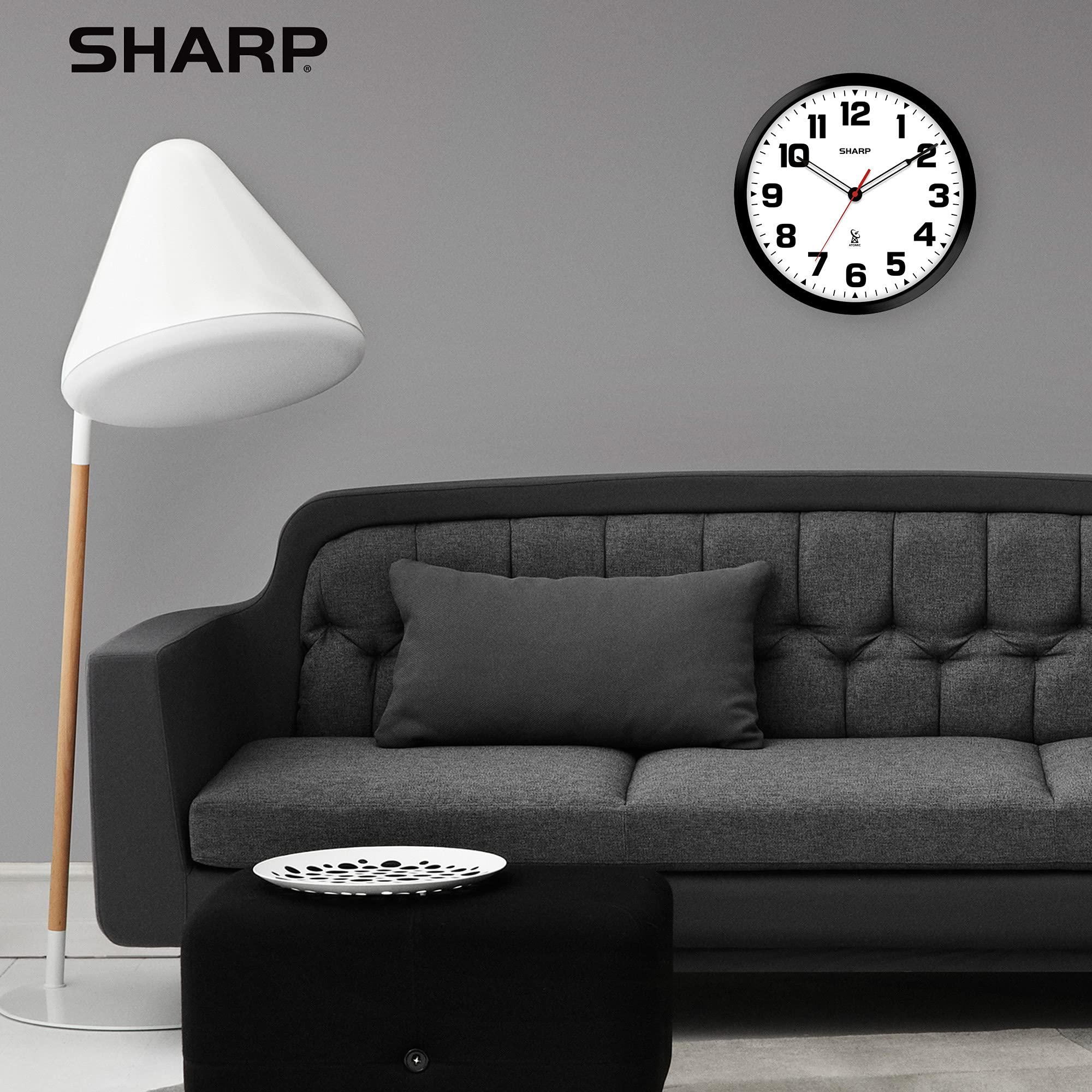 Sharp clock battery compartment view emphasizing easy battery replacement