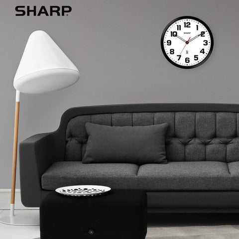 Sharp clock battery compartment view emphasizing easy battery replacement