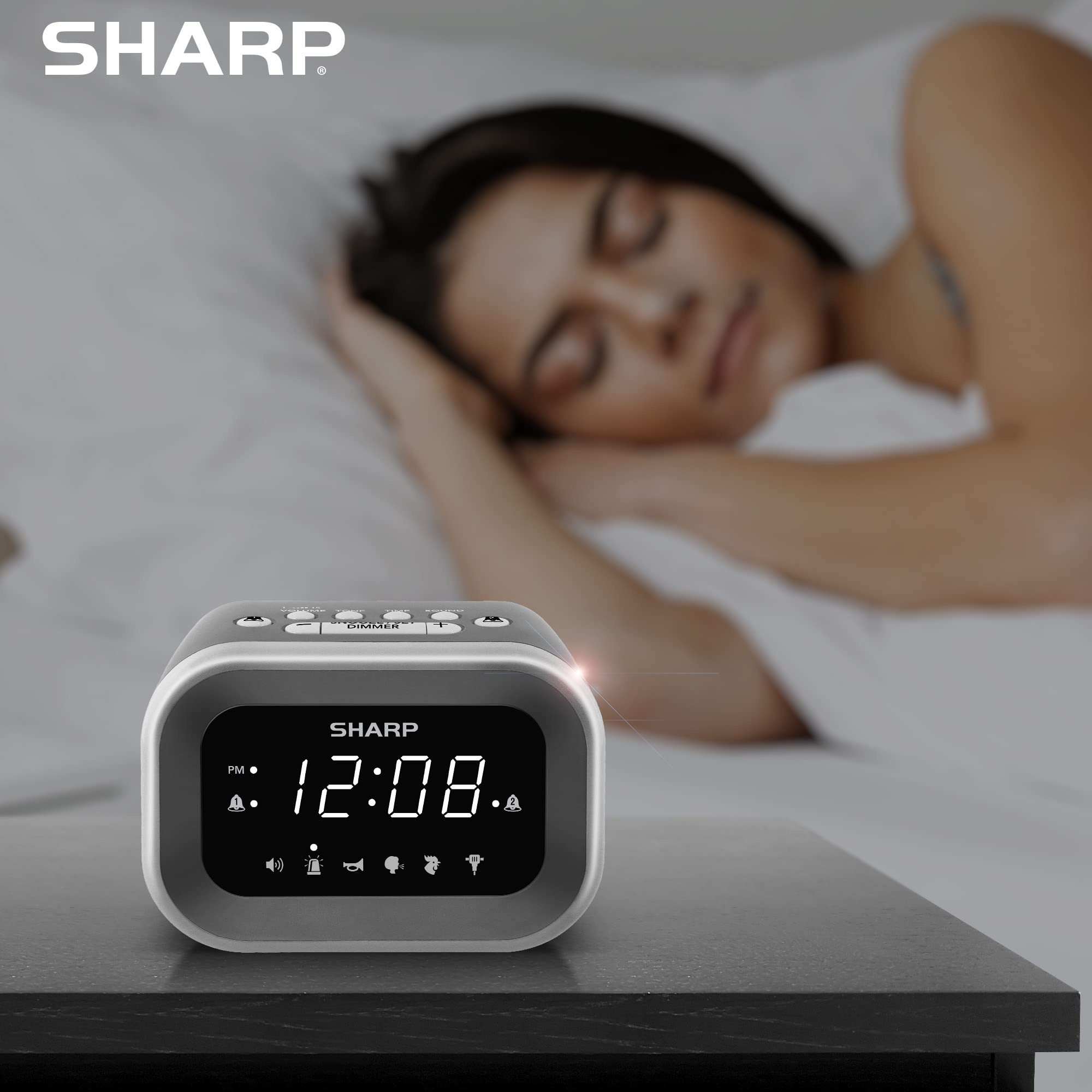 Sharp size comparison with smartphone showing compact footprint for small nightstands