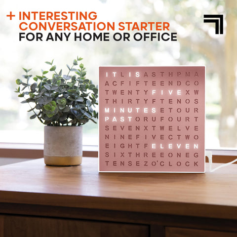 Sharper Image on home office desk adding style and quick time reference