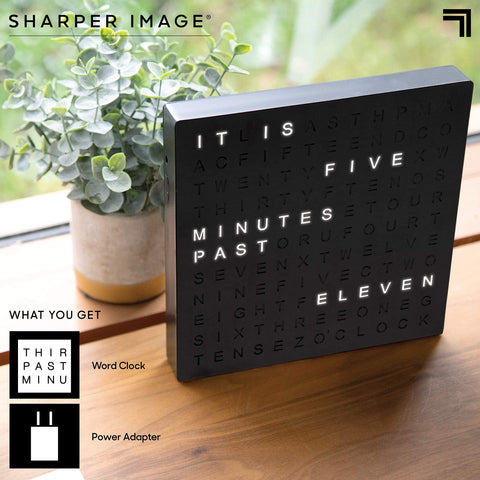 Sharper Image on desk beside laptop adding stylish function and focus