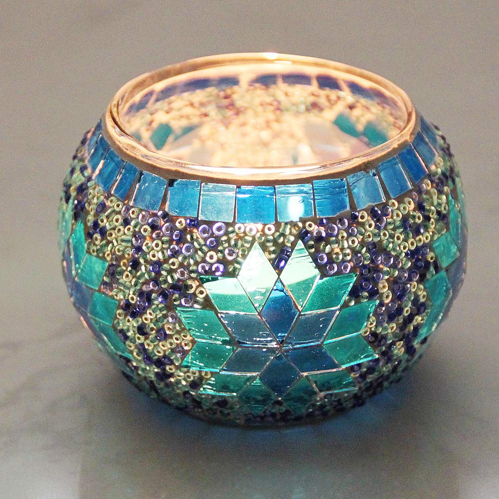 SHMILMH red glass holder lit on table creating warm colorful ambiance