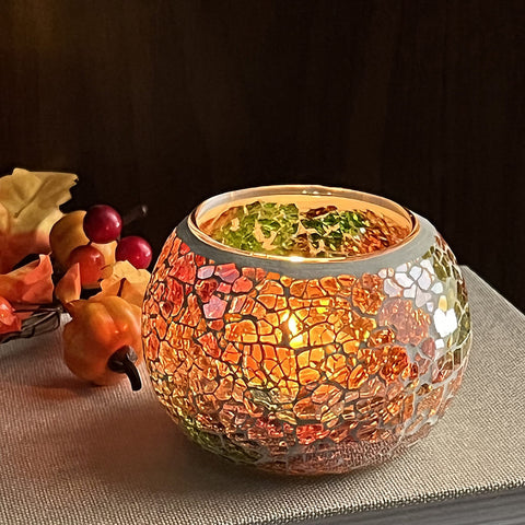 SHMILMH yellow votive close-up revealing mosaic cracks and bright ambient glow benefit